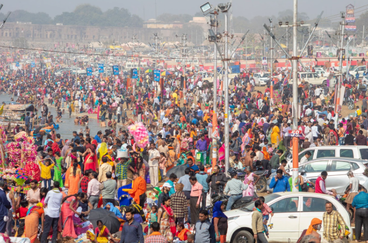 Large crowd at a public gathering with waste management and cleanliness services supporting a sustainable event.