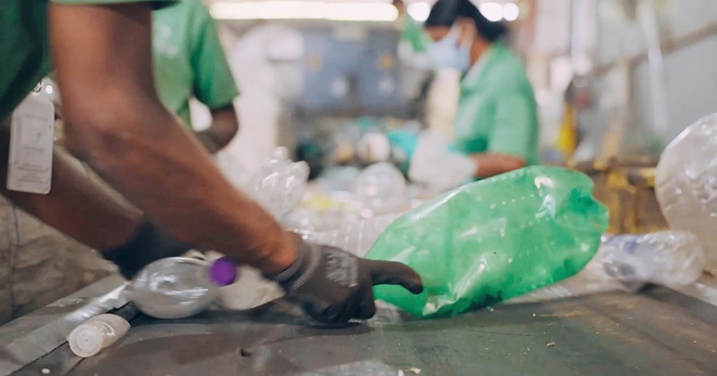 Plastic waste being sorted for recycling at a sustainable waste management facility